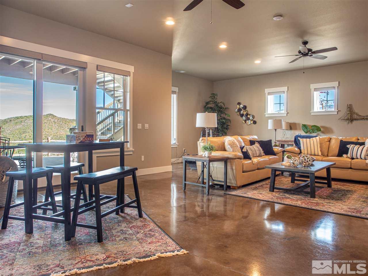 1690 Circle Stone Court Reno, NV 89523 - Photo 27 of 40 a living room with furniture wooden floor and a table