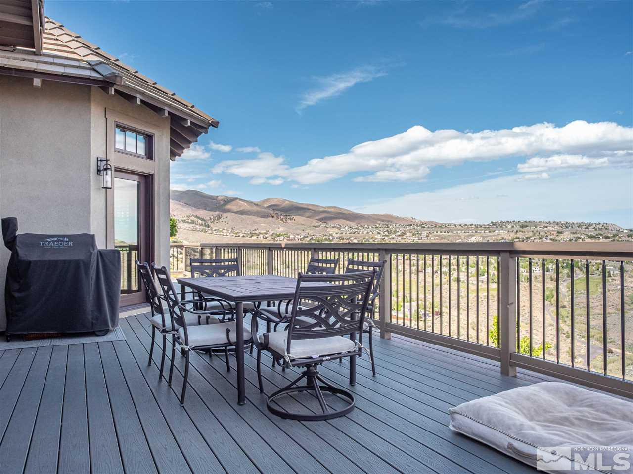1690 Circle Stone Court Reno, NV 89523 - Photo 31 of 40 a view of a roof deck with table and chairs