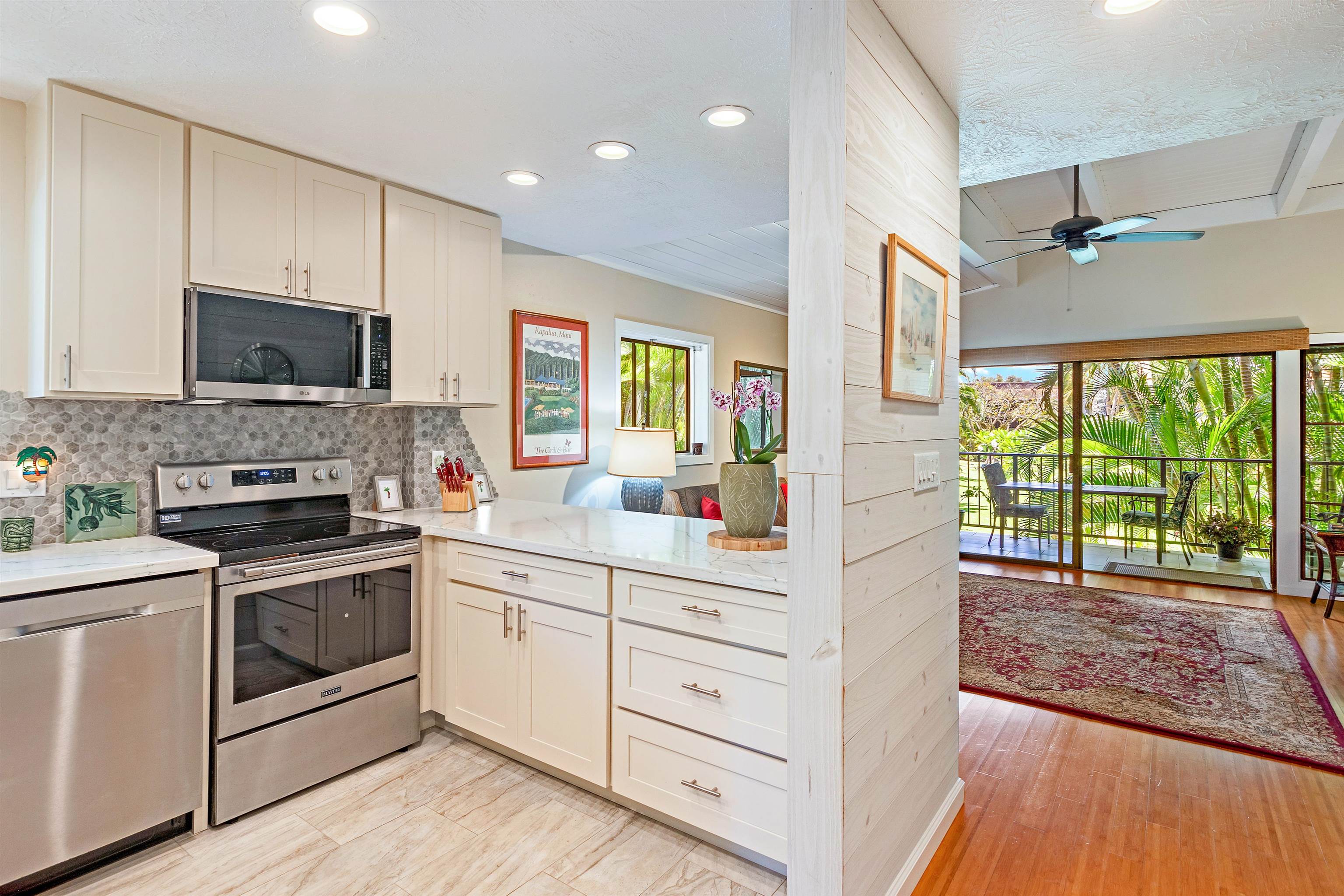 a kitchen with a stove a sink and a microwave