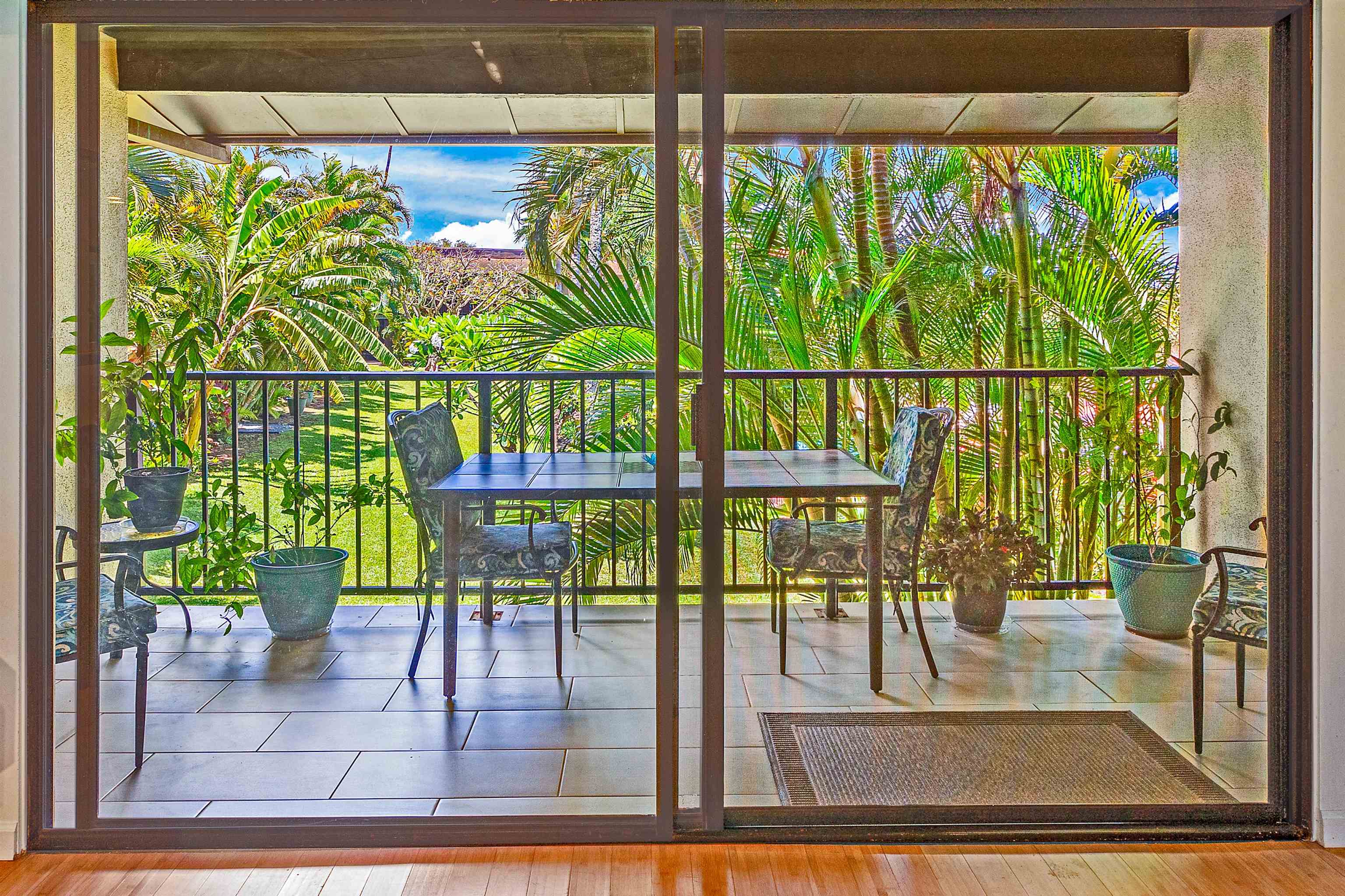 3788 Lower Honoapiilani Road, Unit D101 Lahaina, HI 96761 - Photo 14 of 40 a view of a living room and a floor to ceiling window