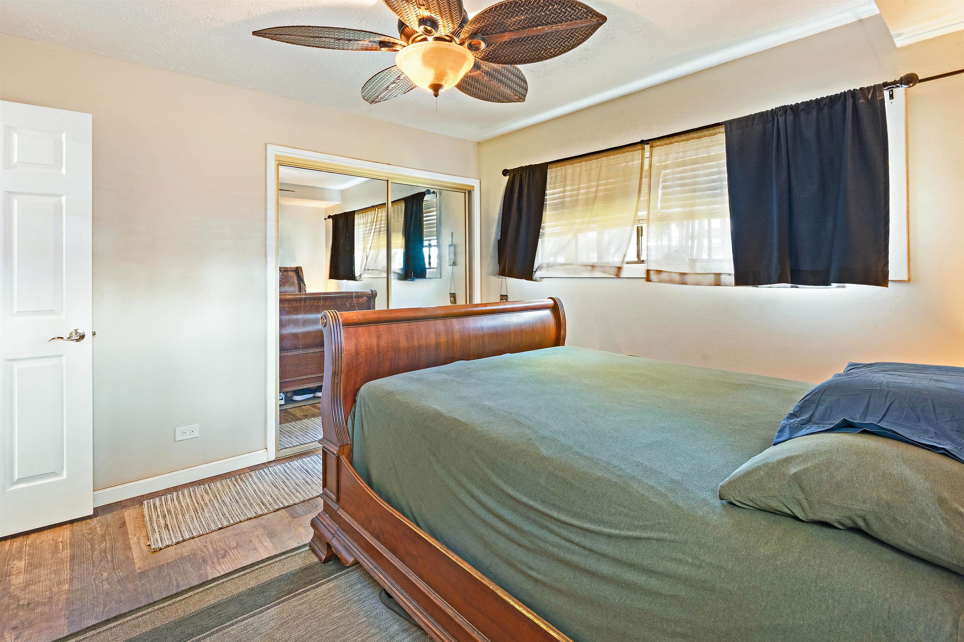 3788 Lower Honoapiilani Road, Unit D101 Lahaina, HI 96761 - Photo 27 of 40 a bedroom with a bed and window
