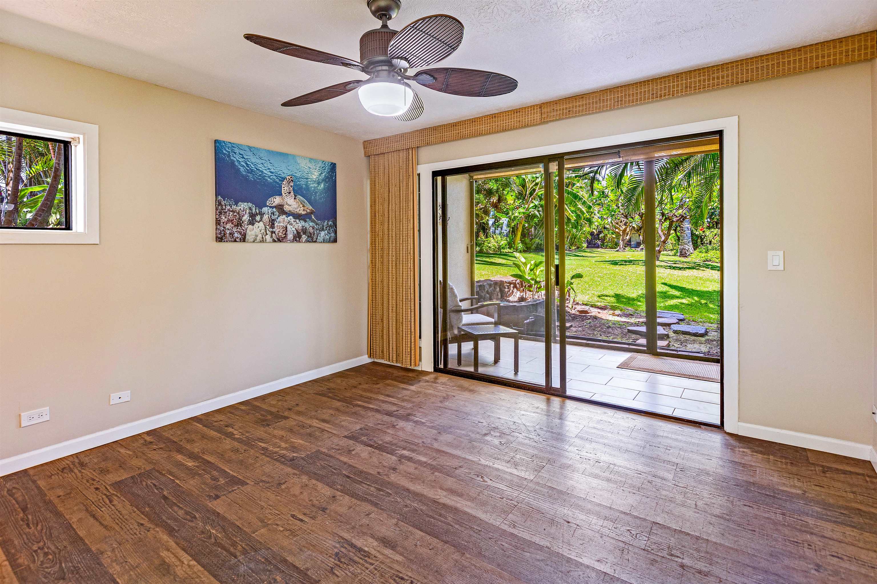 3788 Lower Honoapiilani Road, Unit D101 Lahaina, HI 96761 - Photo 29 of 40 a view of an empty room with wooden floor and a window