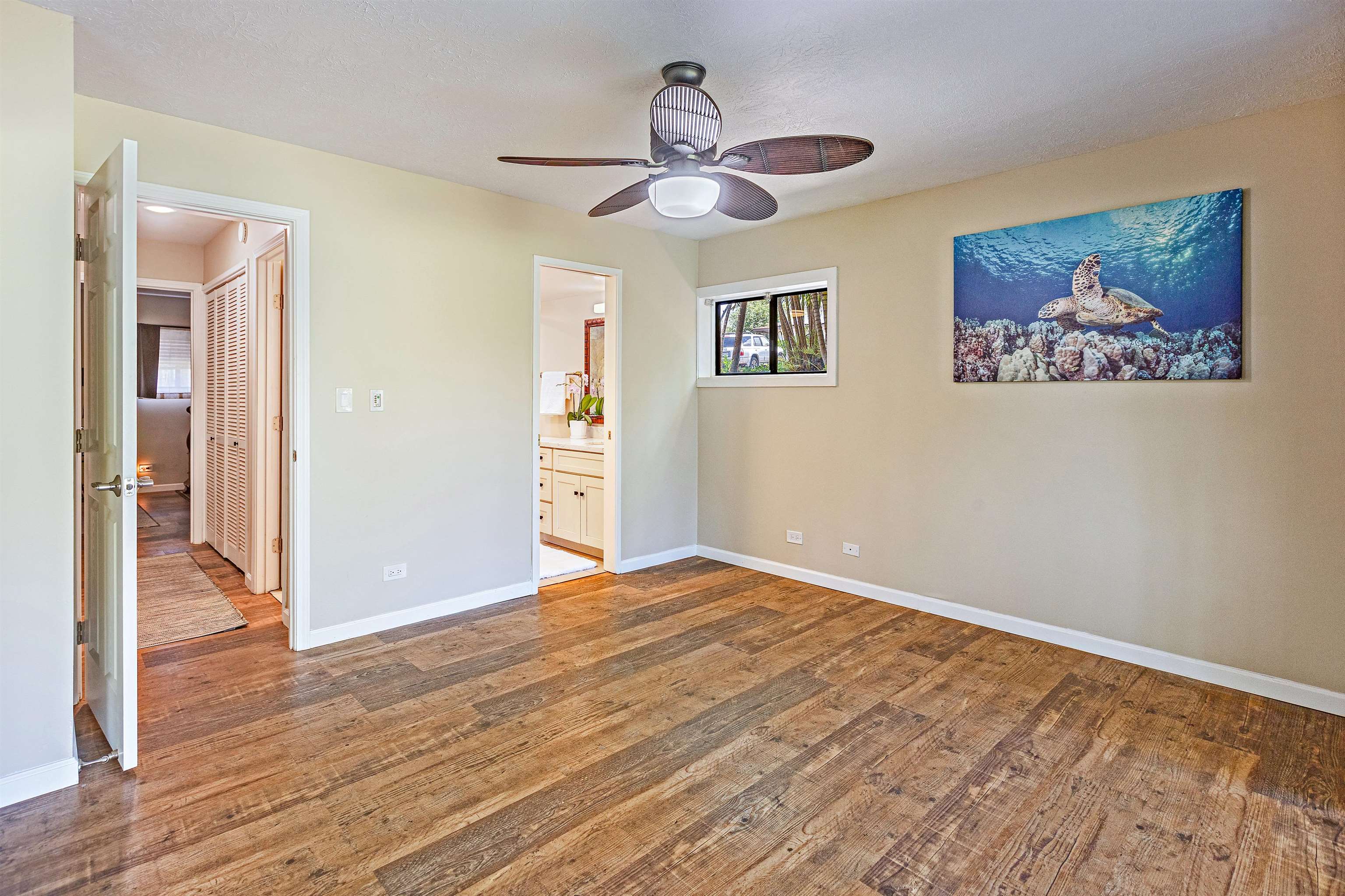 3788 Lower Honoapiilani Road, Unit D101 Lahaina, HI 96761 - Photo 32 of 40 a view of empty room with wooden floor