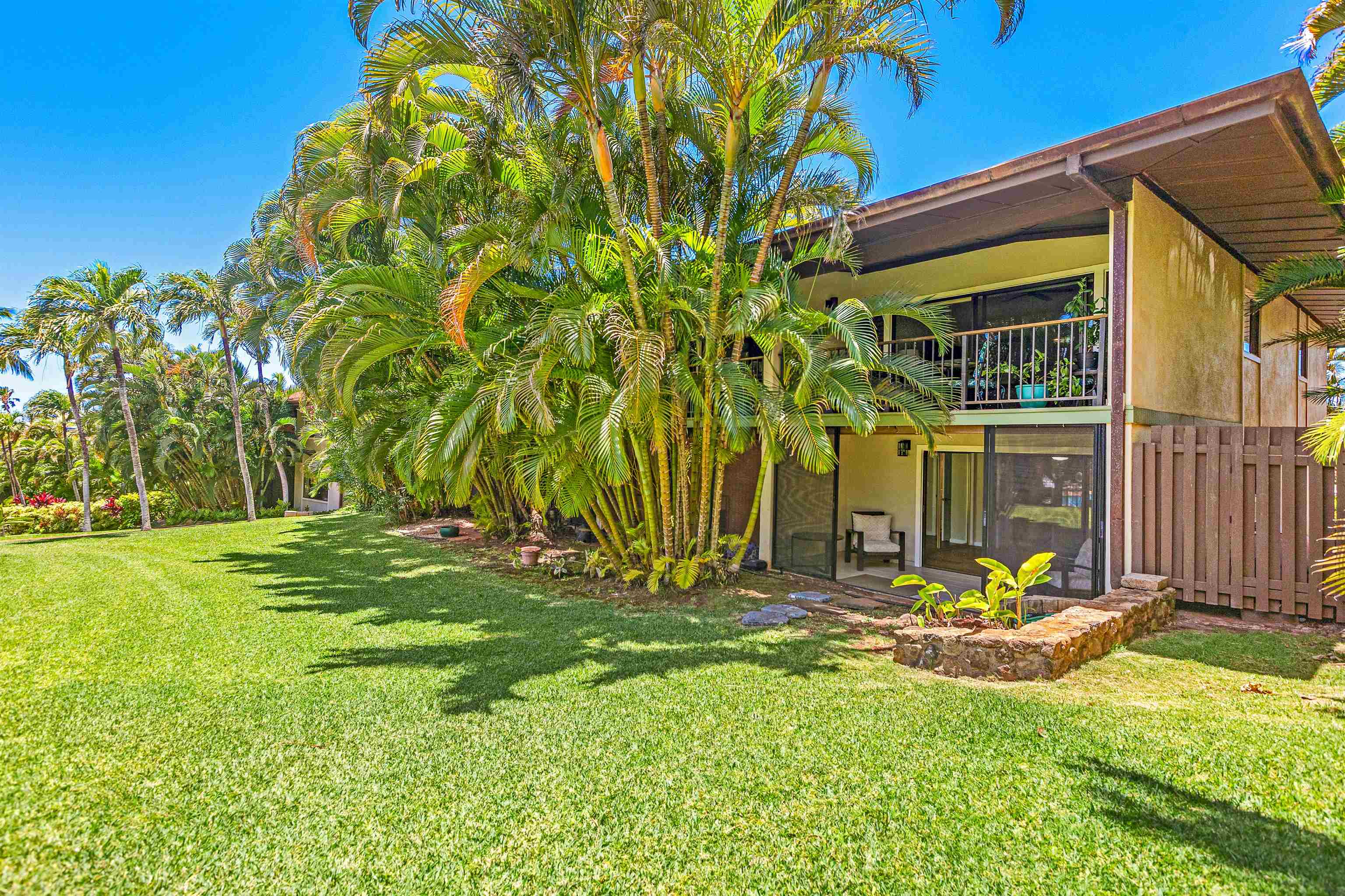 3788 Lower Honoapiilani Road, Unit D101 Lahaina, HI 96761 - Photo 40 of 40 a front view of a house with a yard