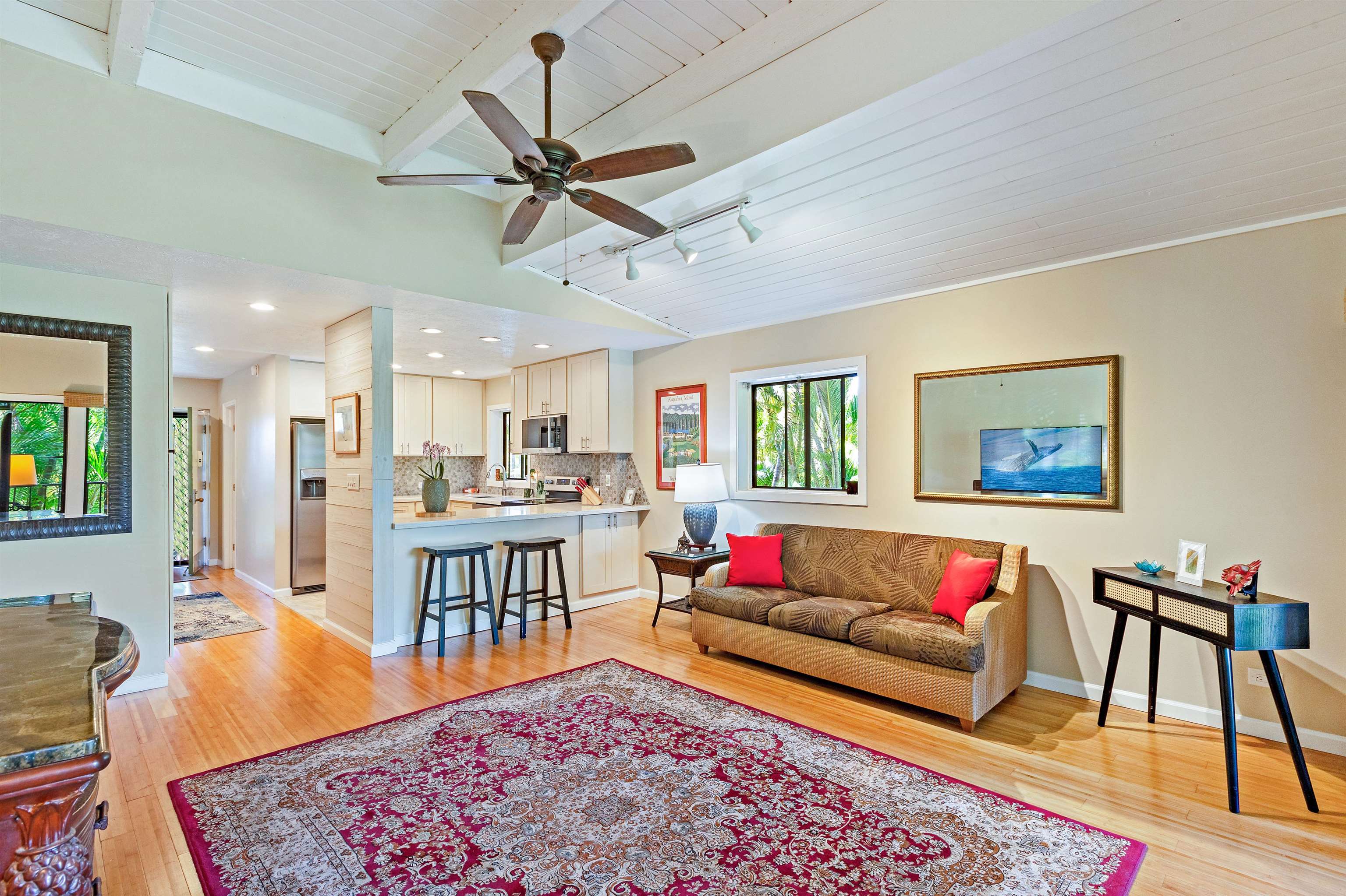 3788 Lower Honoapiilani Road, Unit D101 Lahaina, HI 96761 - Photo 4 of 40 a living room with furniture and a wooden floor