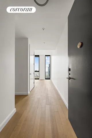 a bedroom with a bed and glass walk in closet