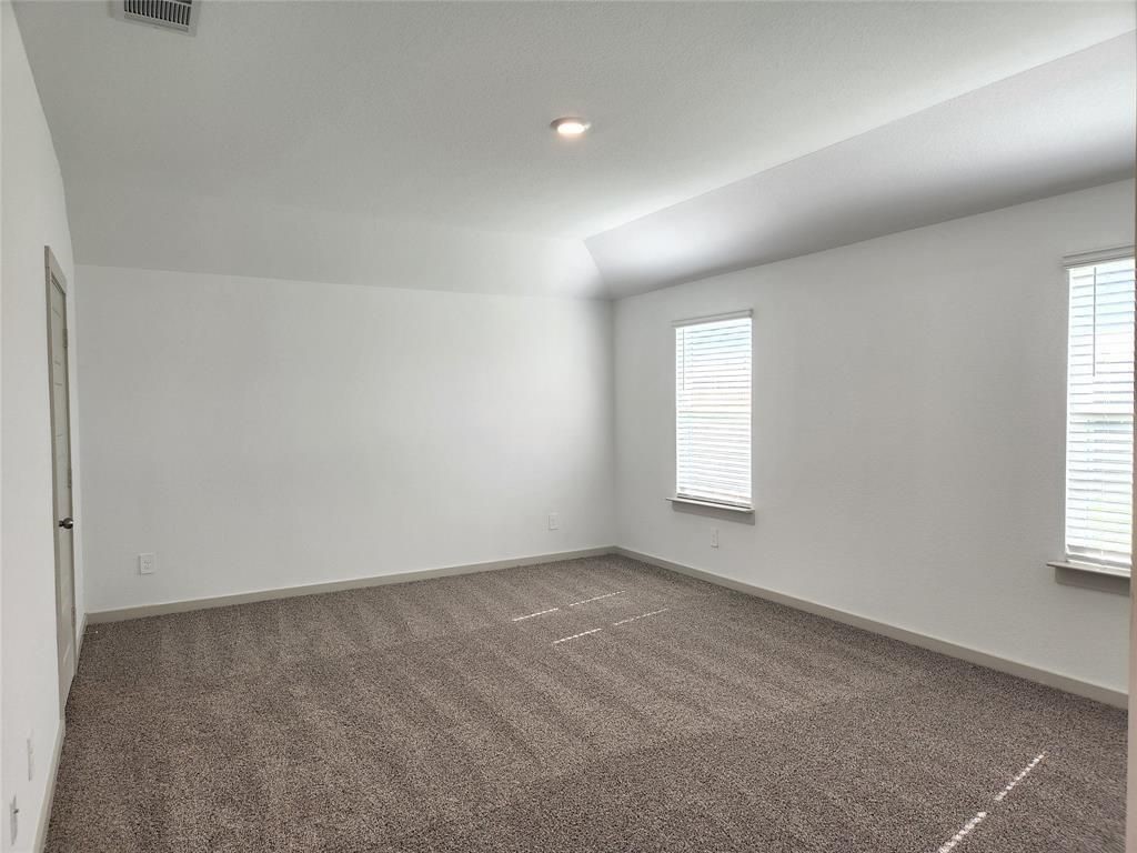 7826 Sleek Flock Lane Rosharon, TX 77583 - Photo 8 of 16 an empty room with windows