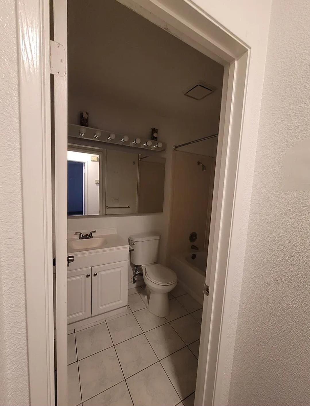 5151 Janell Way Carmichael, CA 95608 - Photo 8 of 15 a bathroom with a granite countertop sink toilet and shower