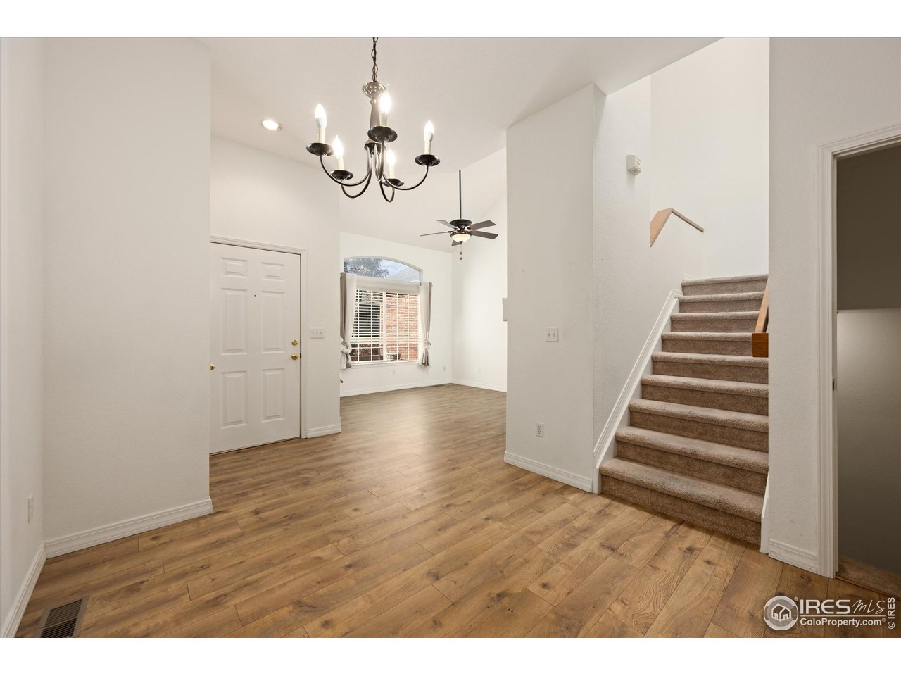 4500 Seneca Street, Unit 71 Fort Collins, CO 80526 - Photo 18 of 37 a view of an entryway with wooden floor