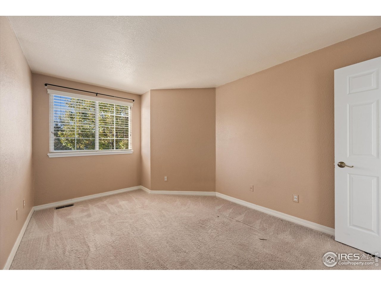 4500 Seneca Street, Unit 71 Fort Collins, CO 80526 - Photo 25 of 37 an empty room with windows