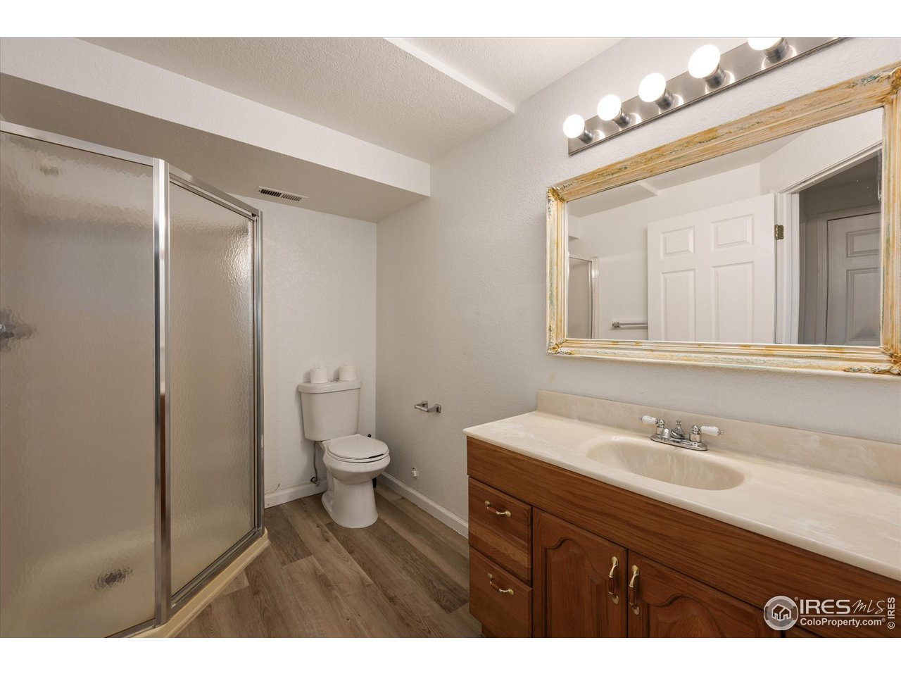4500 Seneca Street, Unit 71 Fort Collins, CO 80526 - Photo 32 of 37 a bathroom with a sink a toilet and a mirror