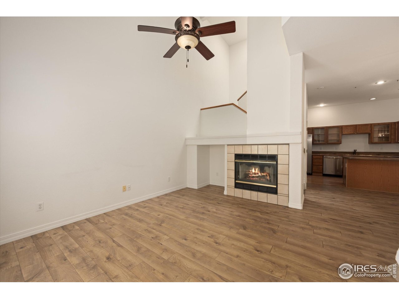 4500 Seneca Street, Unit 71 Fort Collins, CO 80526 - Photo 6 of 37 a view of empty room with kitchen and fireplace