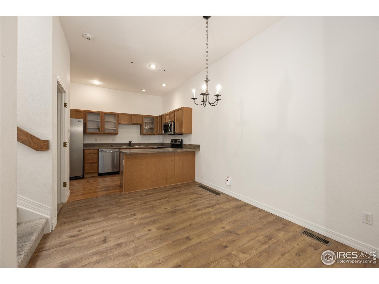 4500 Seneca Street, Unit 71 Fort Collins, CO 80526 - Photo 9 of 37 a view of kitchen view with stainless steel appliances wooden floor and view living room