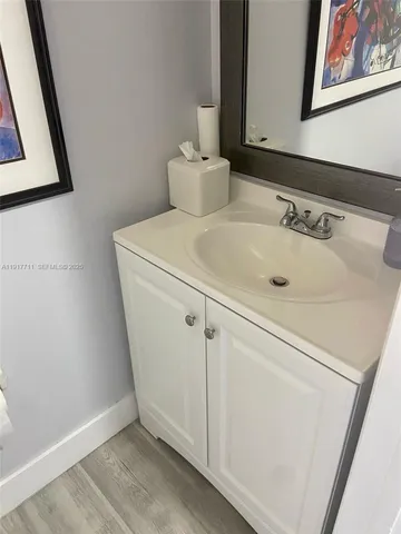 a bathroom with a sink and mirror