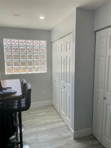 a workspace with furniture and a window