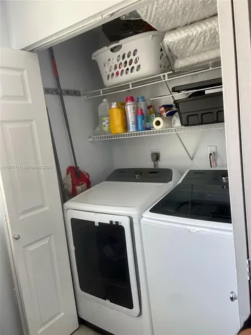 a utility room with dryer and washer