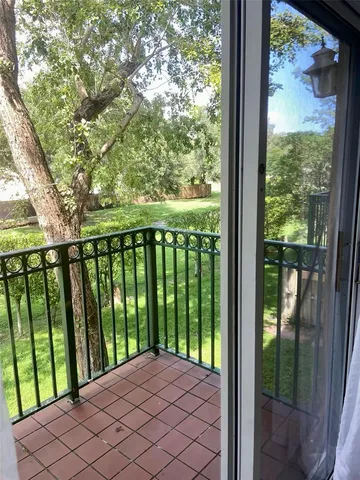 a view of backyard with large trees