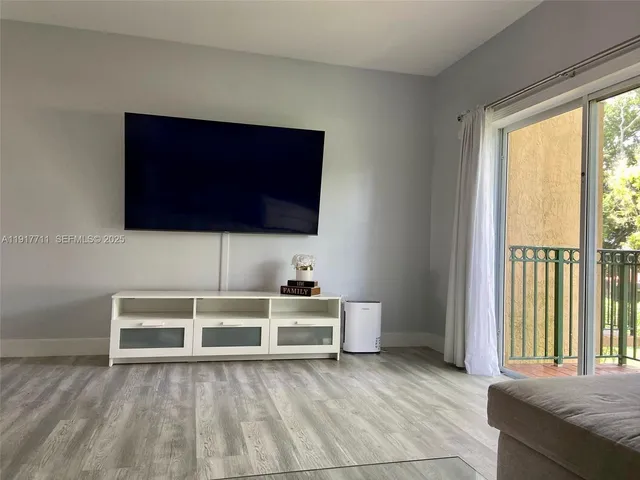 a view of a livingroom with furniture and front door
