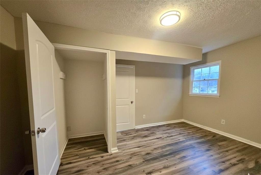 321 Tarragon Way Southwest Atlanta, GA 30331 - Photo 13 of 15 a view of a room with wooden floor and a window