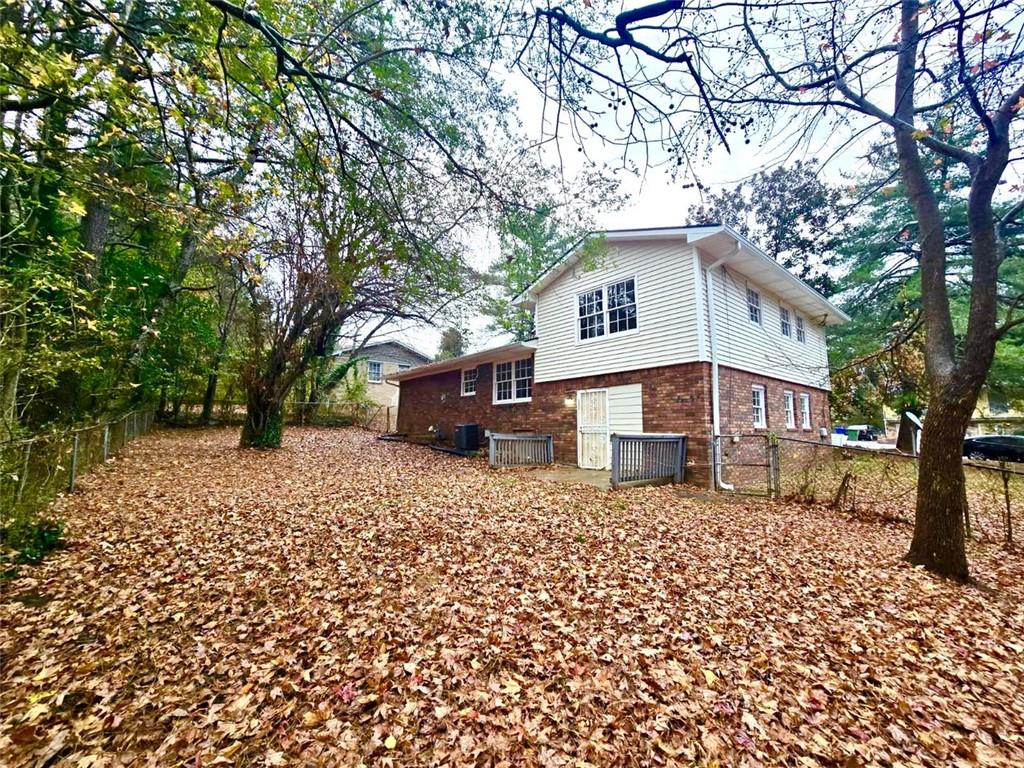 321 Tarragon Way Southwest Atlanta, GA 30331 - Photo 14 of 15 a house that has a tree in front of it