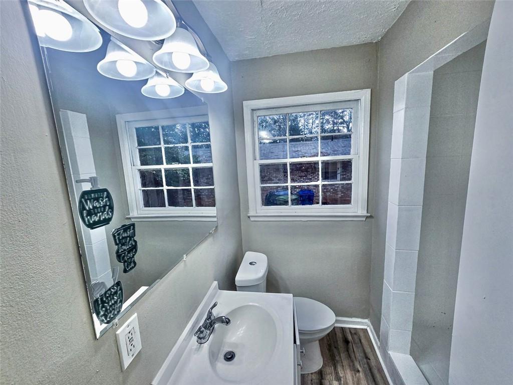 321 Tarragon Way Southwest Atlanta, GA 30331 - Photo 10 of 15 a bathroom with a sink and a mirror