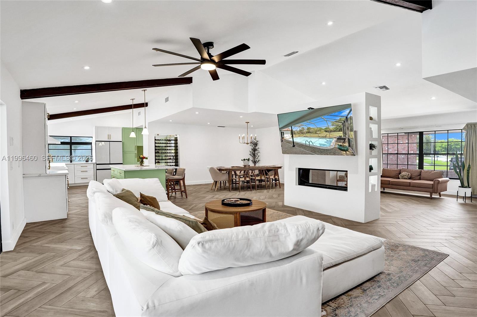 18428 102nd Way South Boca Raton, FL 33498 - Photo 31 of 70 a living room with furniture and a flat screen tv