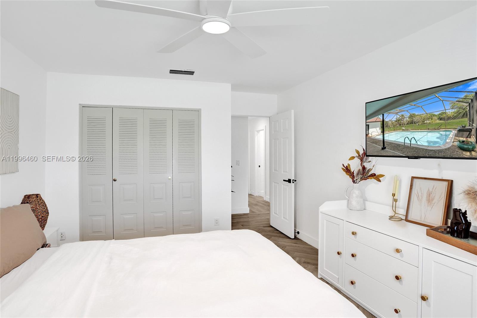 18428 102nd Way South Boca Raton, FL 33498 - Photo 46 of 70 a bedroom with a bed and a dresser