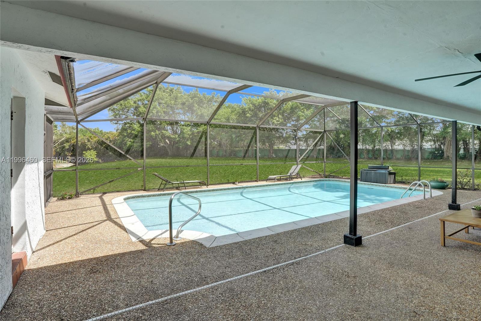 18428 102nd Way South Boca Raton, FL 33498 - Photo 60 of 70 a view of sitting area with porch and wooden floor