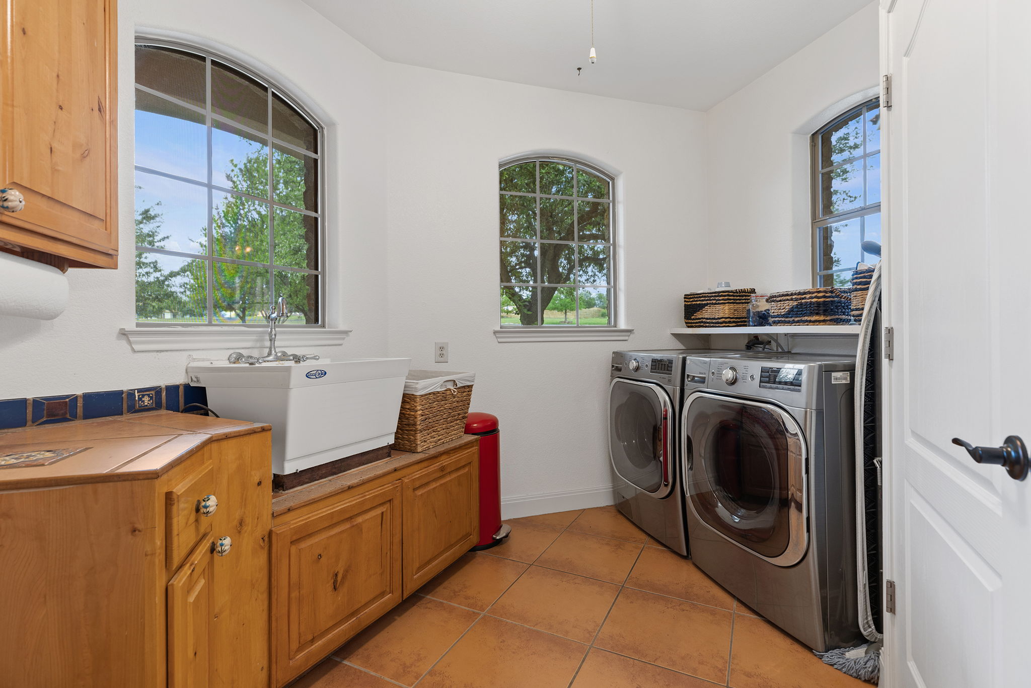 17308 St Therese Road Manor, TX 78653 - Photo 24 of 40 a utility room with sink dryer and washer