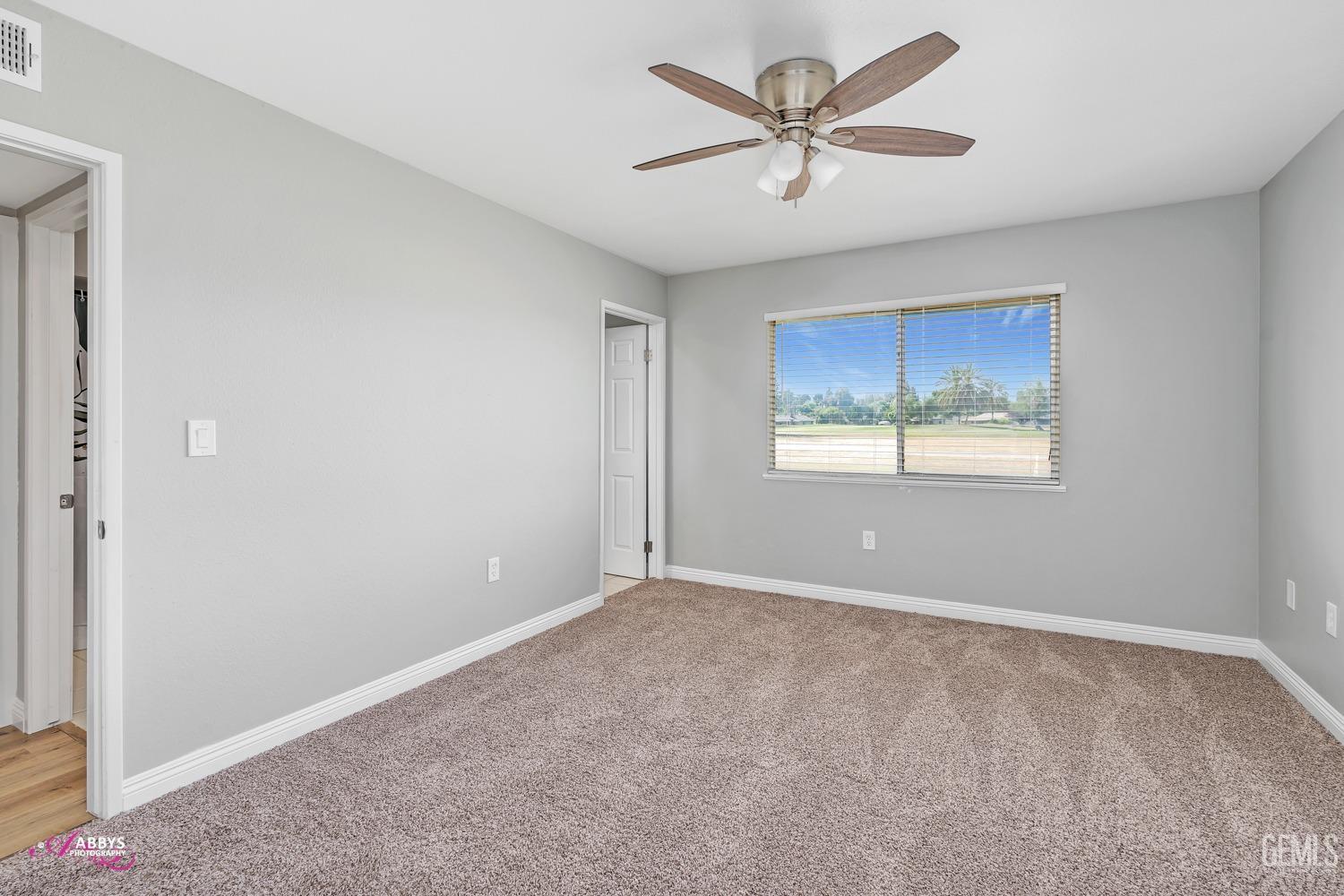 Undisclosed Address Bakersfield, CA 93309 - Photo 17 of 42 a view of an empty room with a window