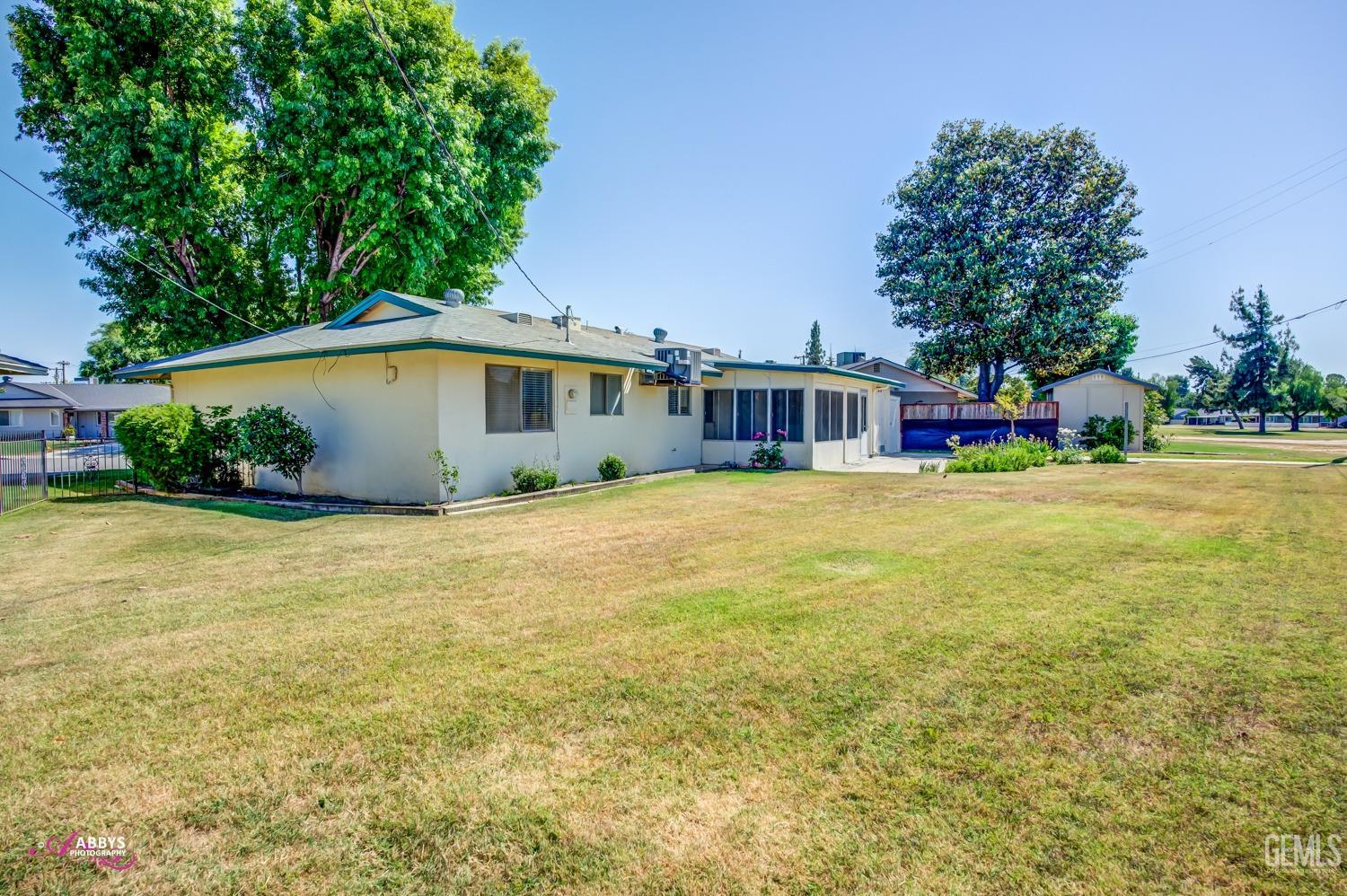 Undisclosed Address Bakersfield, CA 93309 - Photo 23 of 42 a house view with swimming pool in front of it