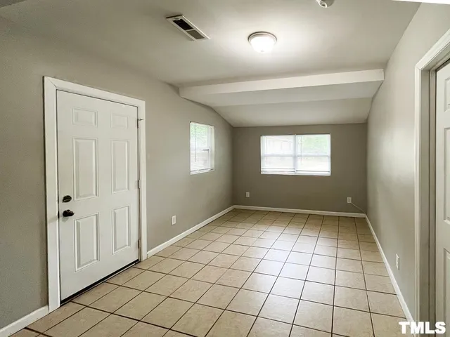 a view of an empty room and window