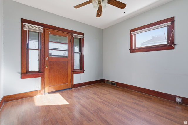 869 West Center Street Provo, UT 84601 - Photo 12 of 32 Empty room with light wood-style floors and ceiling fan