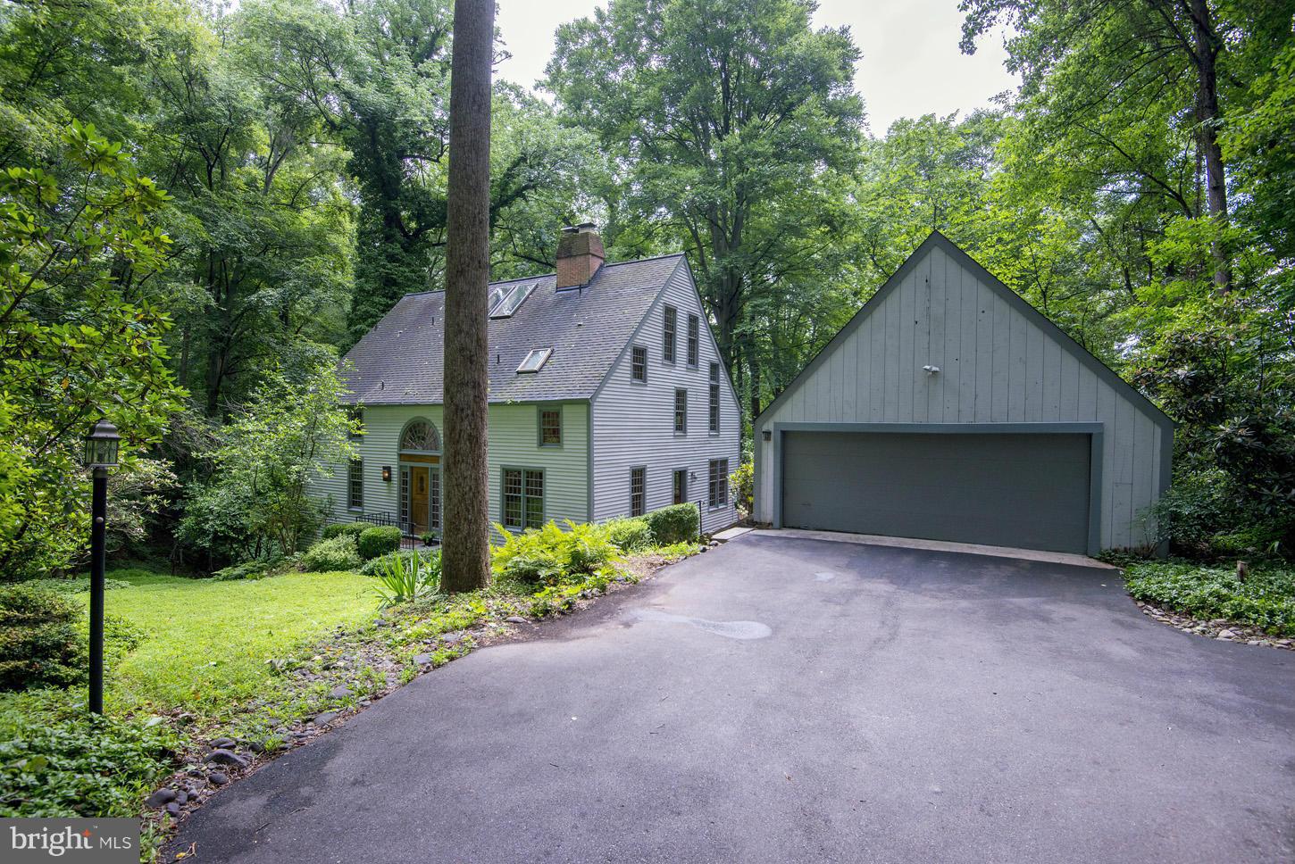 11545 Springridge Road Potomac, MD 20854 - Photo 2 of 30 a front view of house with yard and trees