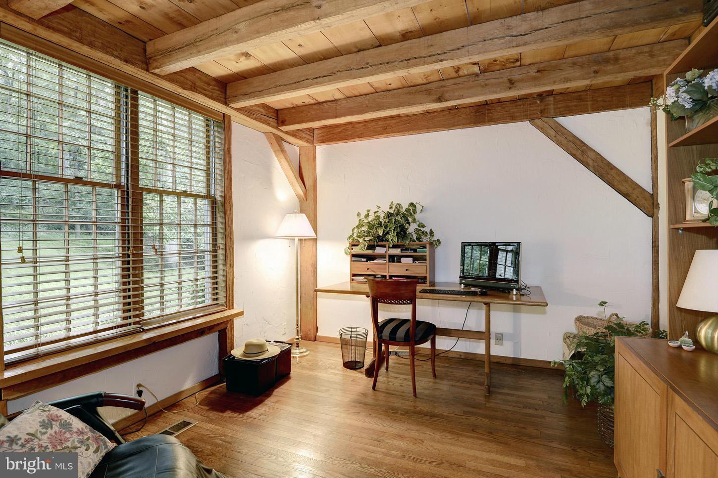 11545 Springridge Road Potomac, MD 20854 - Photo 12 of 30 a reading room with wooden floor furniture and a window