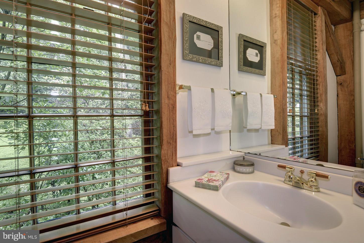 11545 Springridge Road Potomac, MD 20854 - Photo 13 of 30 a bathroom with a sink and a mirror