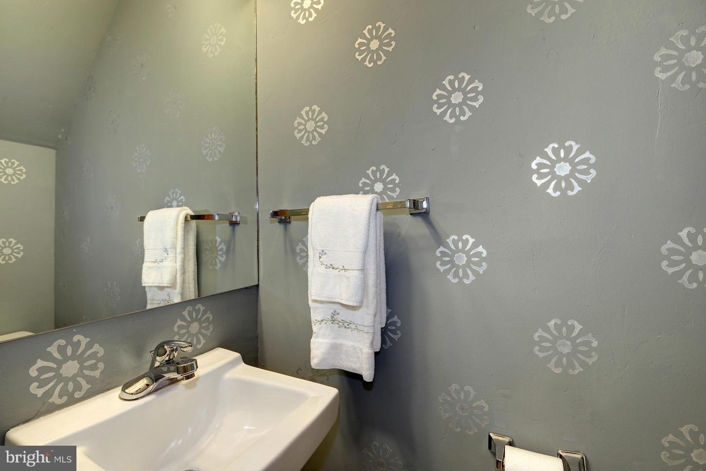 11545 Springridge Road Potomac, MD 20854 - Photo 22 of 30 a bathroom with a sink and mirror