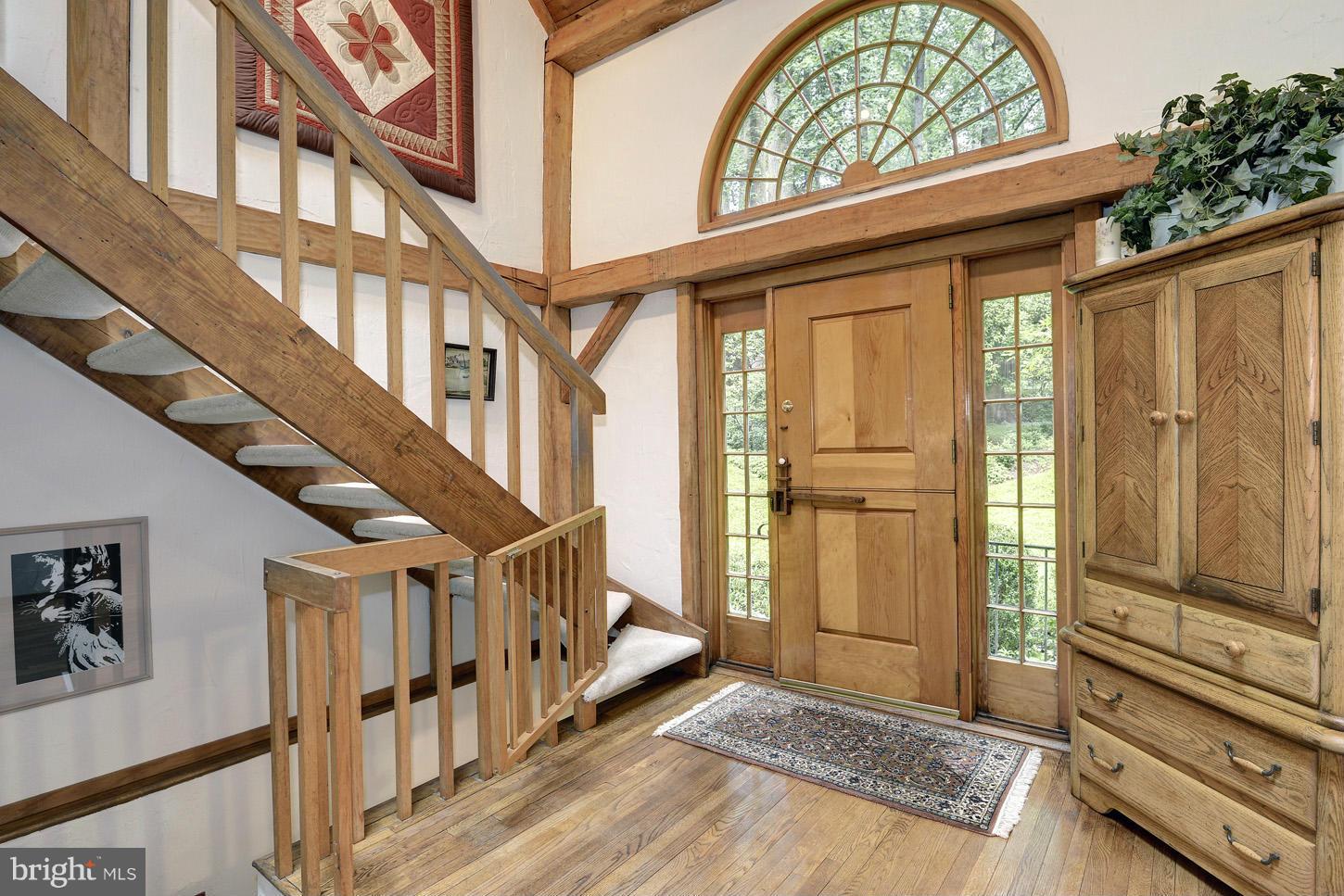 11545 Springridge Road Potomac, MD 20854 - Photo 4 of 30 a view of an entryway with wooden floor and door