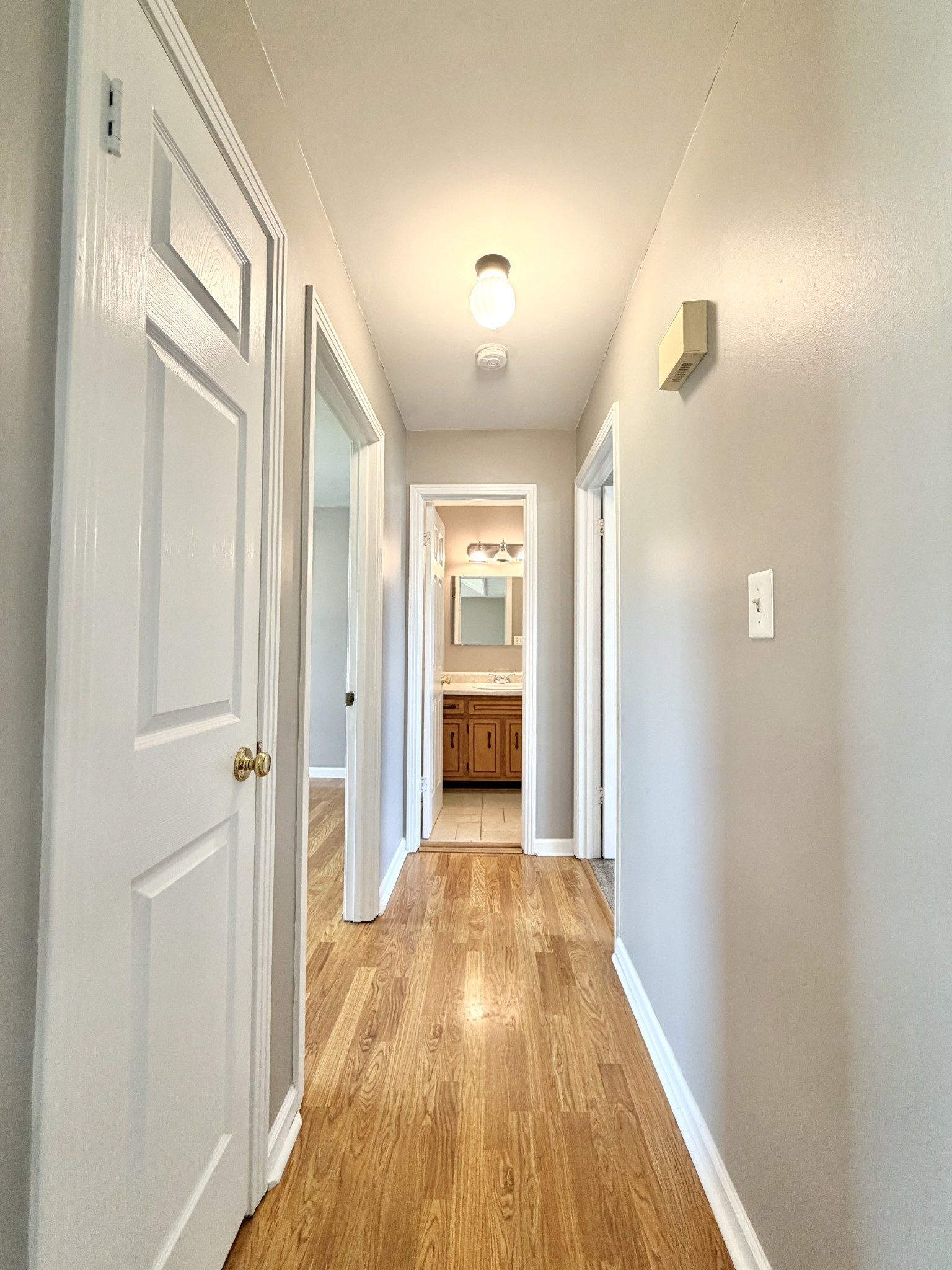 3411 Polly Drive Clarksville, TN 37042 - Photo 15 of 28 a view of a hallway with wooden floor and a bathroom