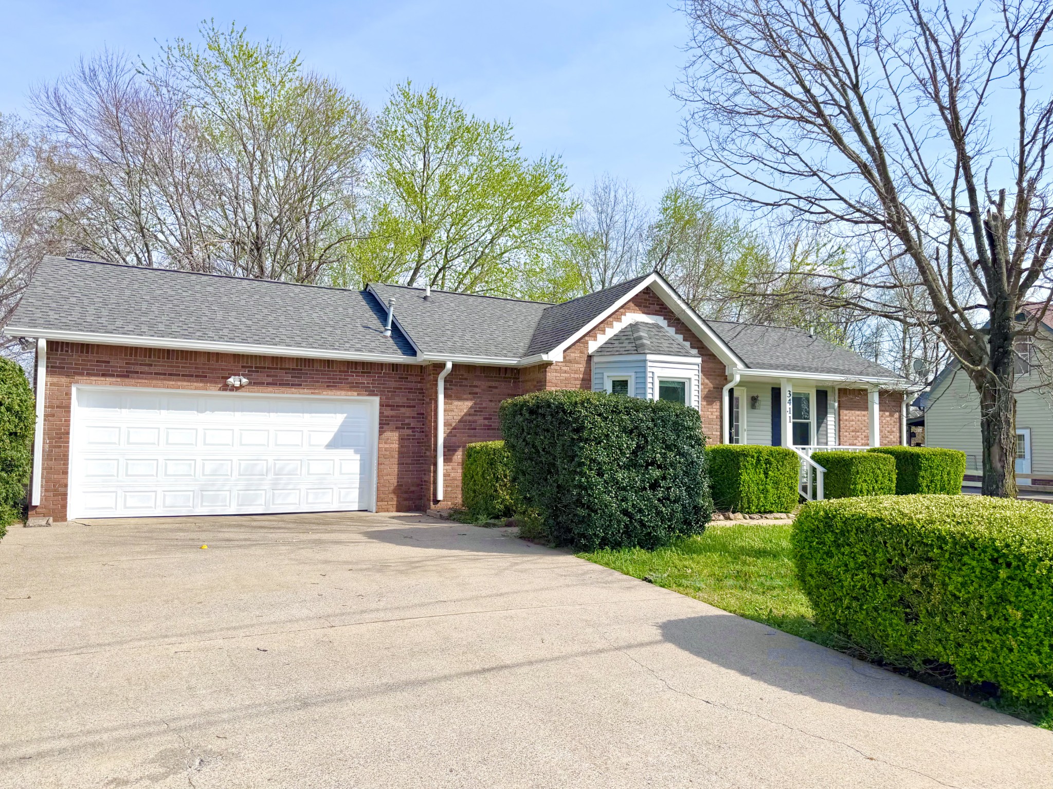 3411 Polly Drive Clarksville, TN 37042 - Photo 2 of 28 a front view of a house with a yard and garage
