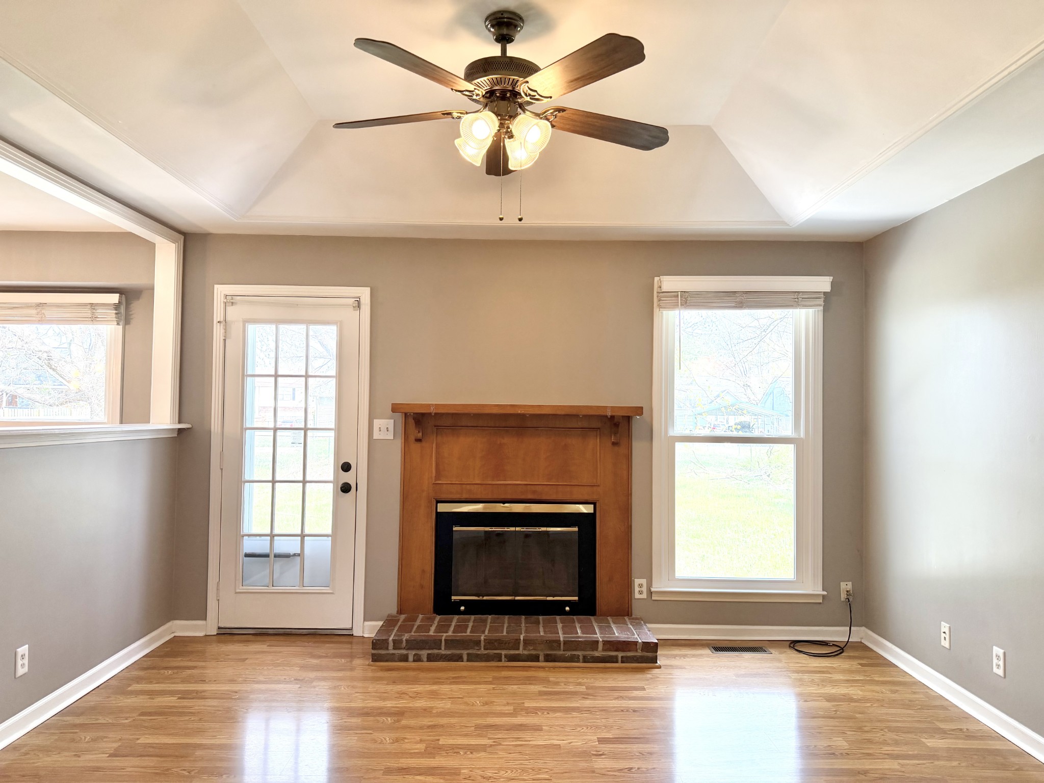 3411 Polly Drive Clarksville, TN 37042 - Photo 8 of 28 an empty room with fireplace and windows