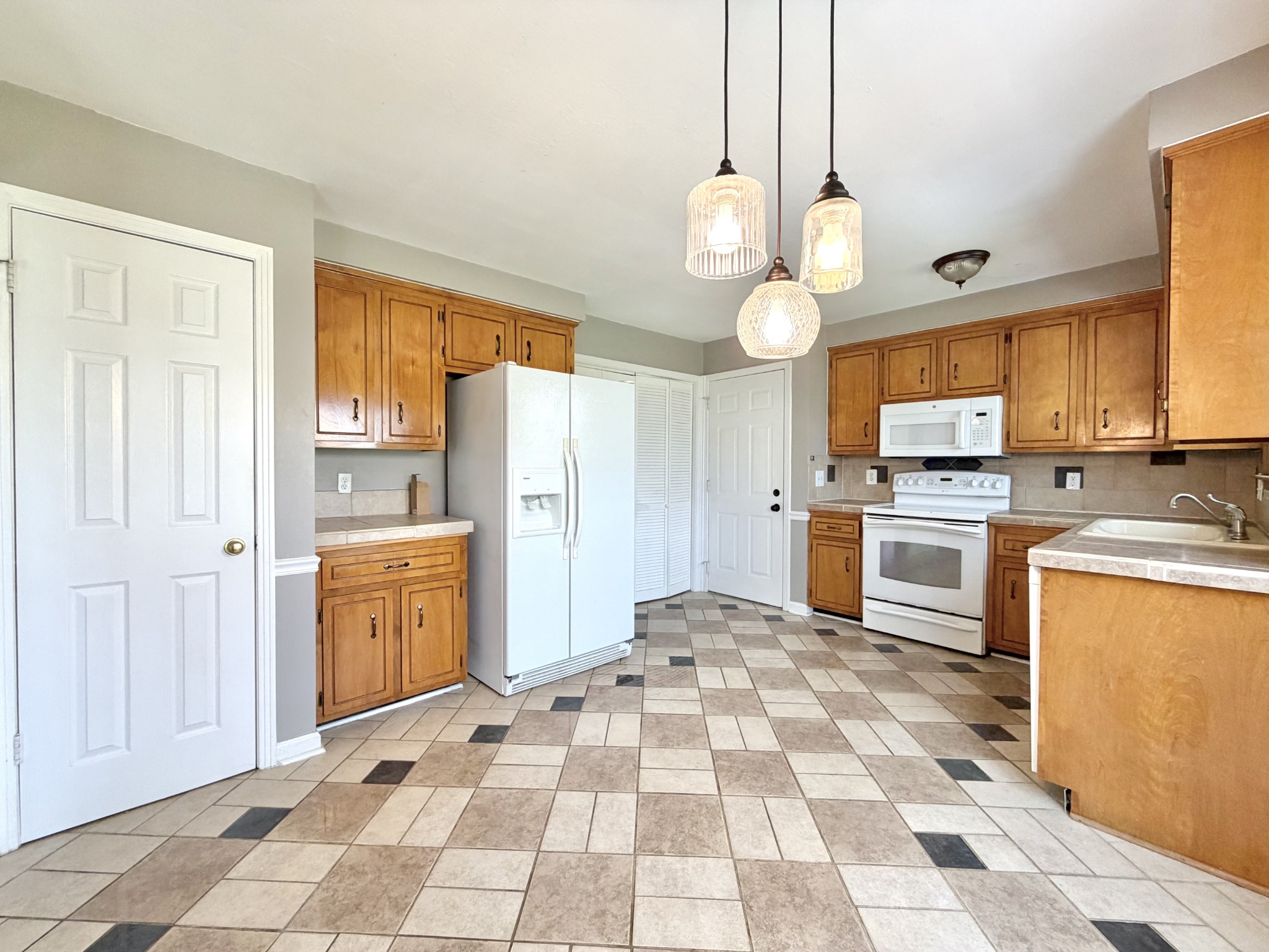 3411 Polly Drive Clarksville, TN 37042 - Photo 10 of 28 a kitchen with stainless steel appliances granite countertop a refrigerator and a stove top oven