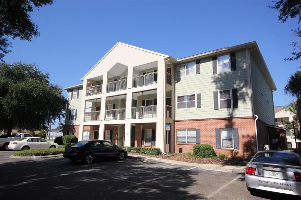 2360 Southwest Archer Road, Unit 806 Gainesville, FL 32608 - Photo 1 of 1 a couple of cars parked in front of a building