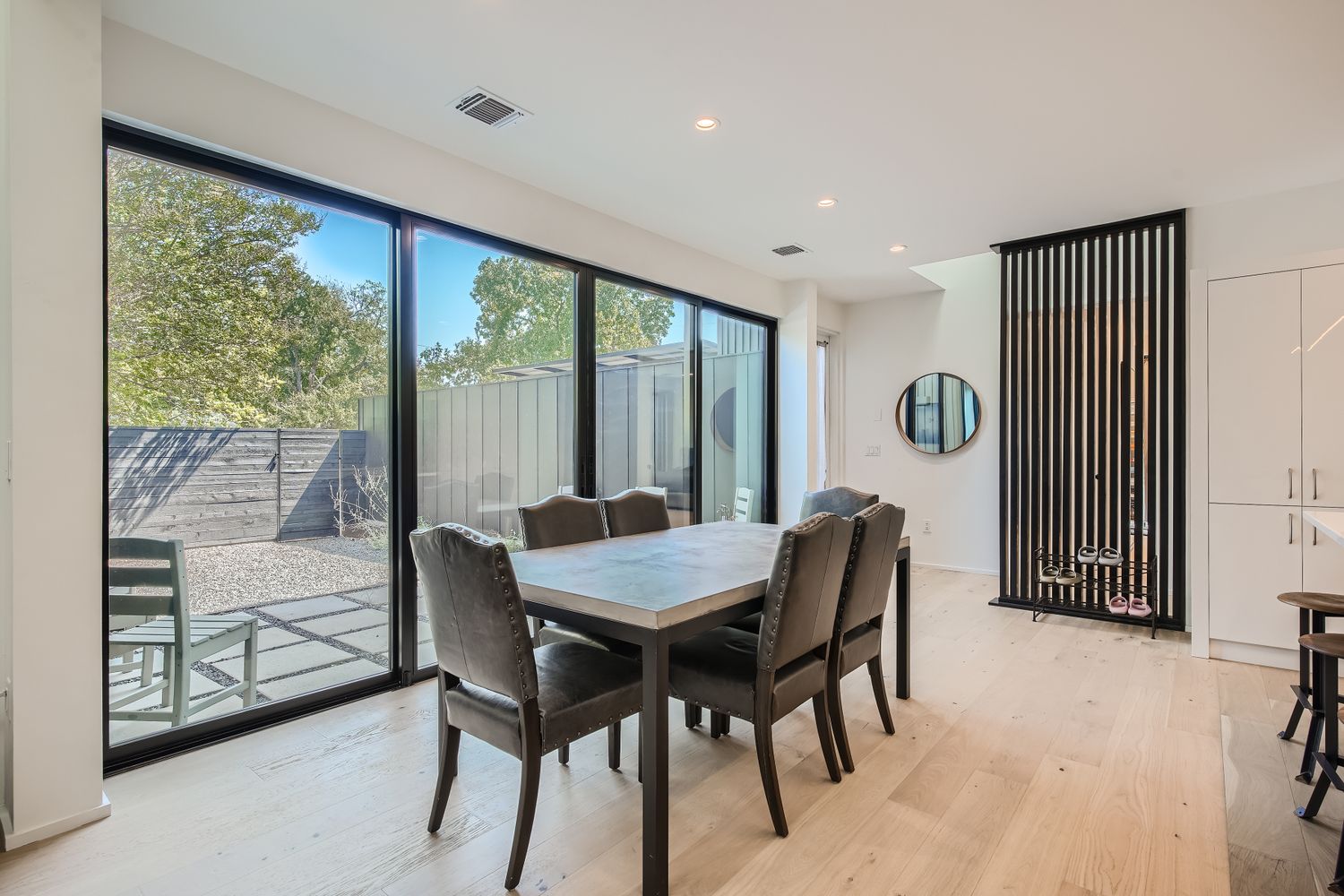 7525 Delafield Lane, Unit A Austin, TX 78752 - Photo 13 of 33 a dining room with furniture and window
