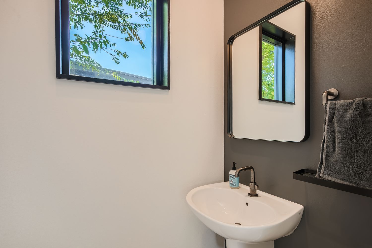 7525 Delafield Lane, Unit A Austin, TX 78752 - Photo 20 of 33 a bathroom with a sink and a mirror