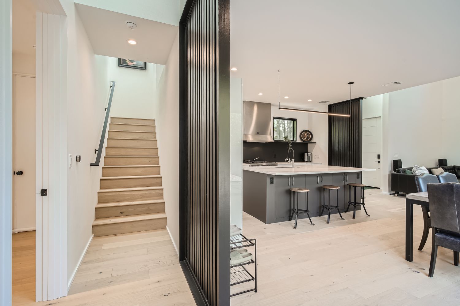 7525 Delafield Lane, Unit A Austin, TX 78752 - Photo 21 of 33 a kitchen with kitchen island granite countertop lots of counter top space and cabinets