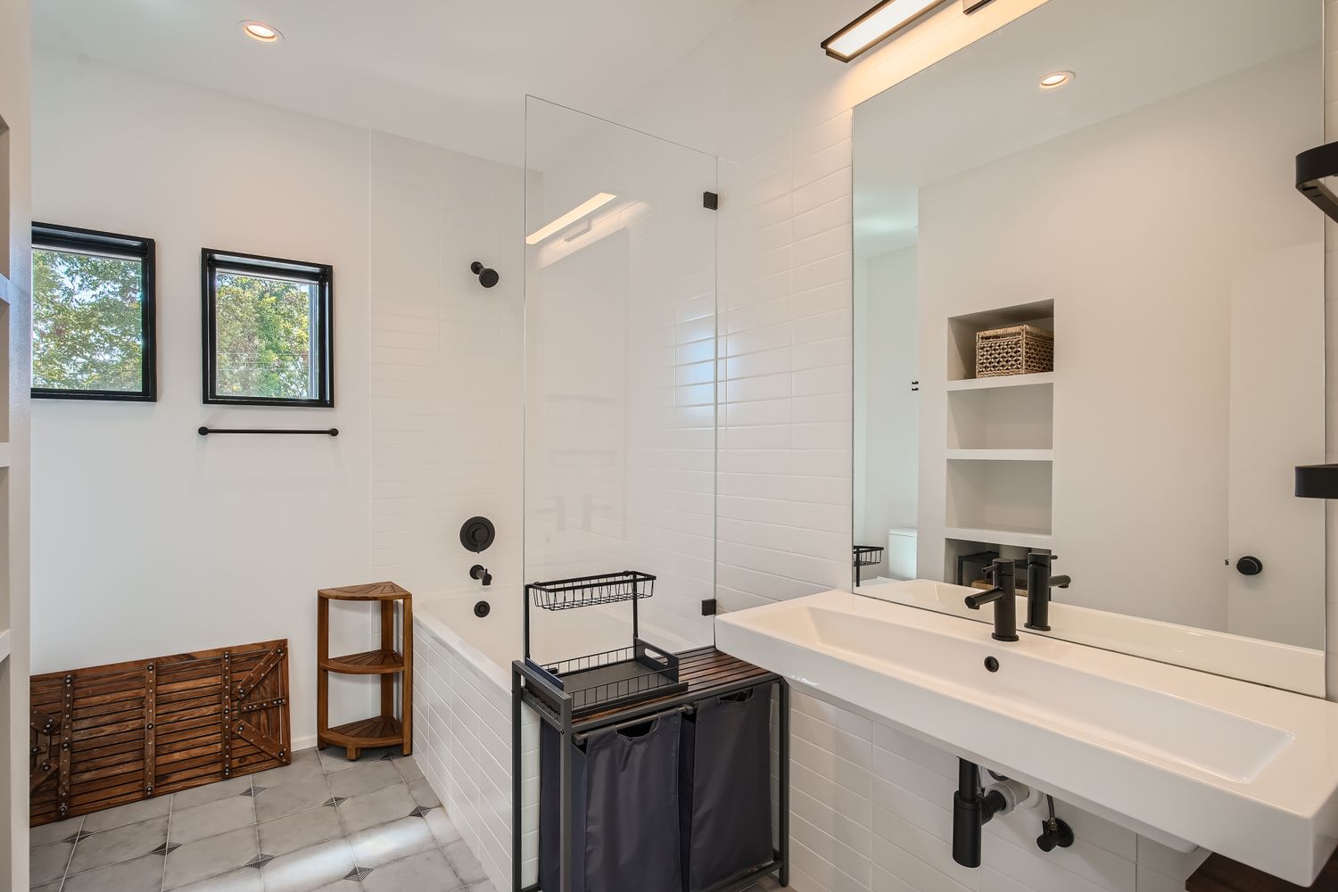7525 Delafield Lane, Unit A Austin, TX 78752 - Photo 23 of 33 a bathroom with a sink a toilet and mirror