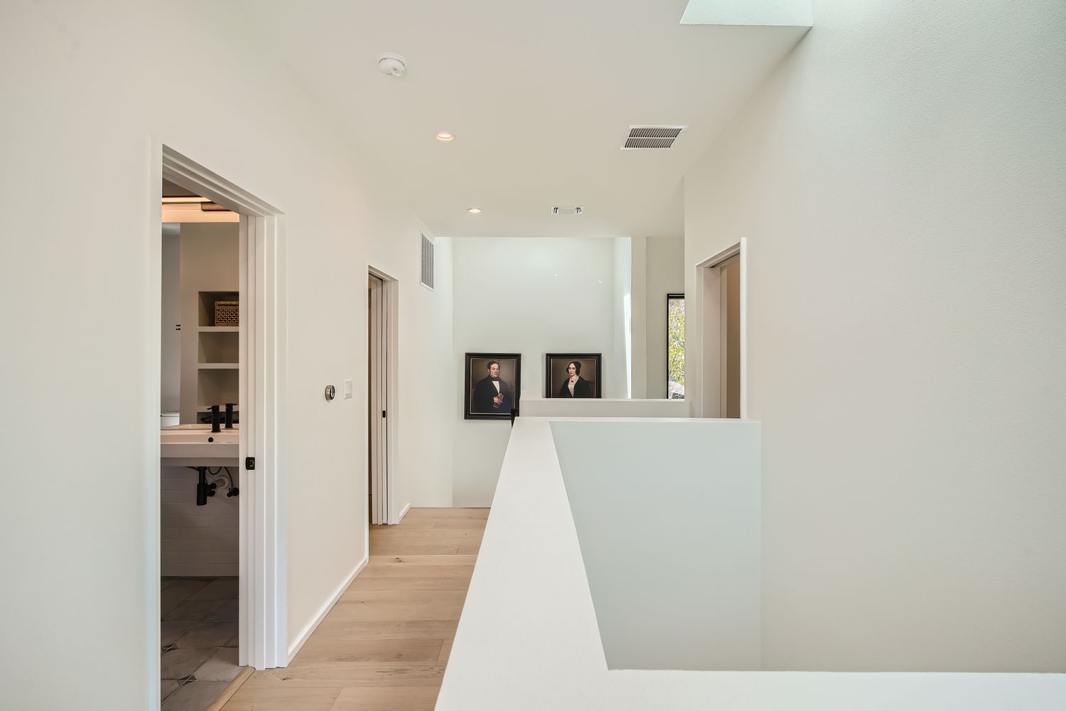 7525 Delafield Lane, Unit A Austin, TX 78752 - Photo 29 of 33 a view of a hallway with wooden floor and cabinet