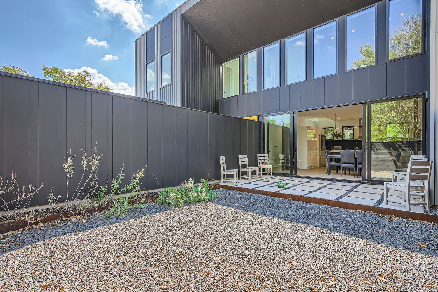 7525 Delafield Lane, Unit A Austin, TX 78752 - Photo 32 of 33 a house view with a outdoor space