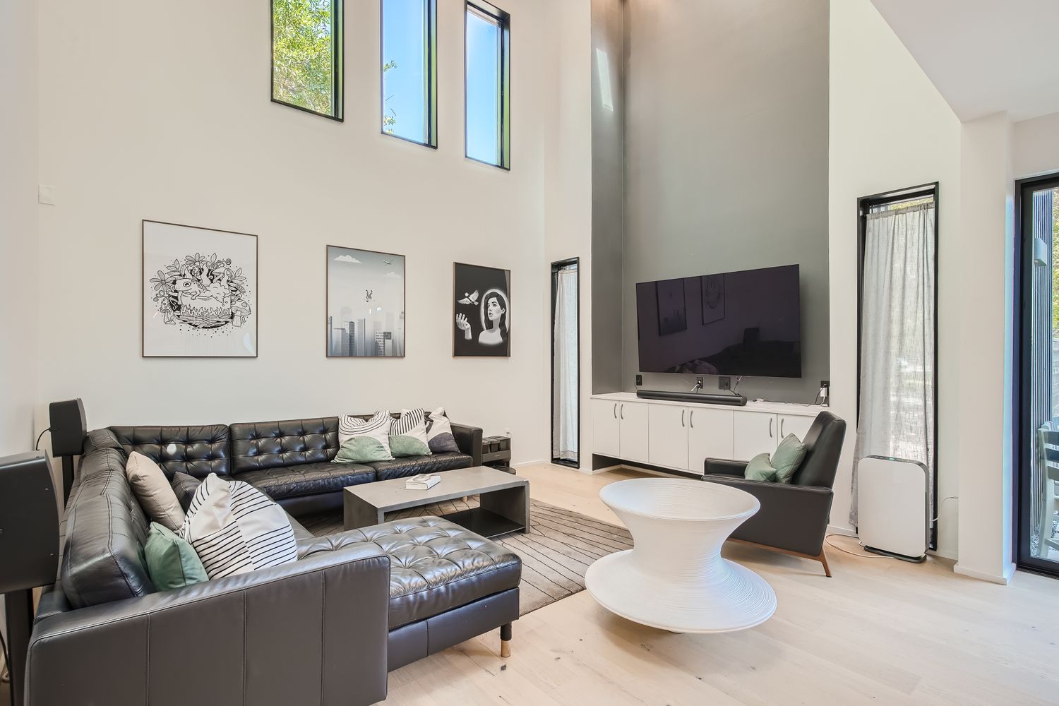7525 Delafield Lane, Unit A Austin, TX 78752 - Photo 5 of 33 a living room with furniture and a flat screen tv